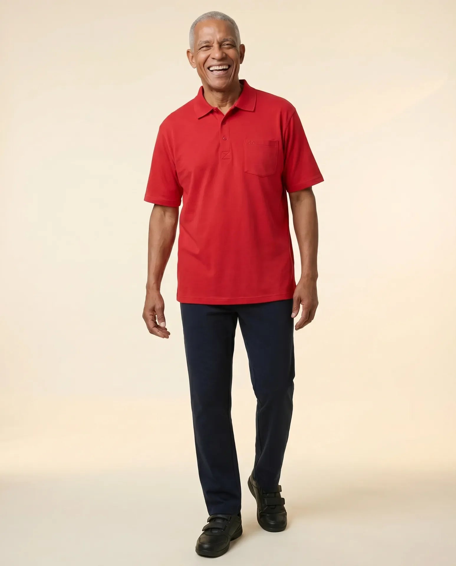 Senior man wearing Ovidis adaptive Ralfie Red polo shirt, easy assisted dressing for seniors