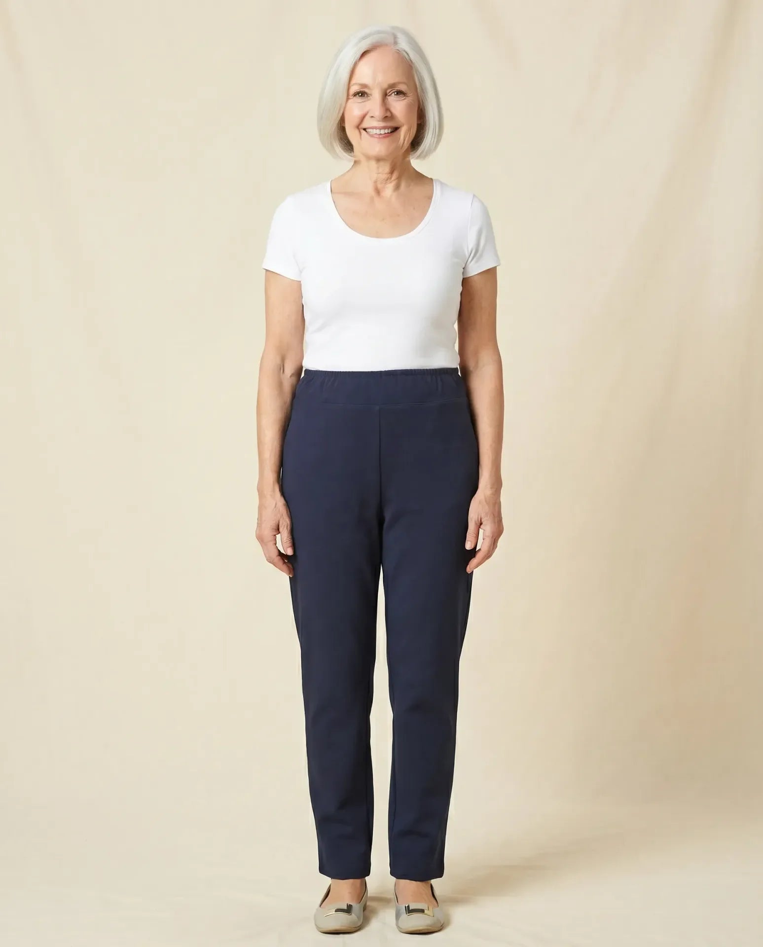 Senior woman wearing Ovidis Tricotti Pants in Navy, full body front view