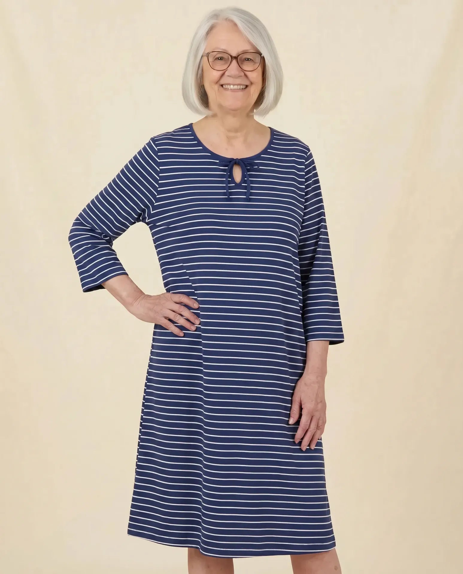 Lea Nightgown - Indigo, senior Asian woman front view, parchment backdrop