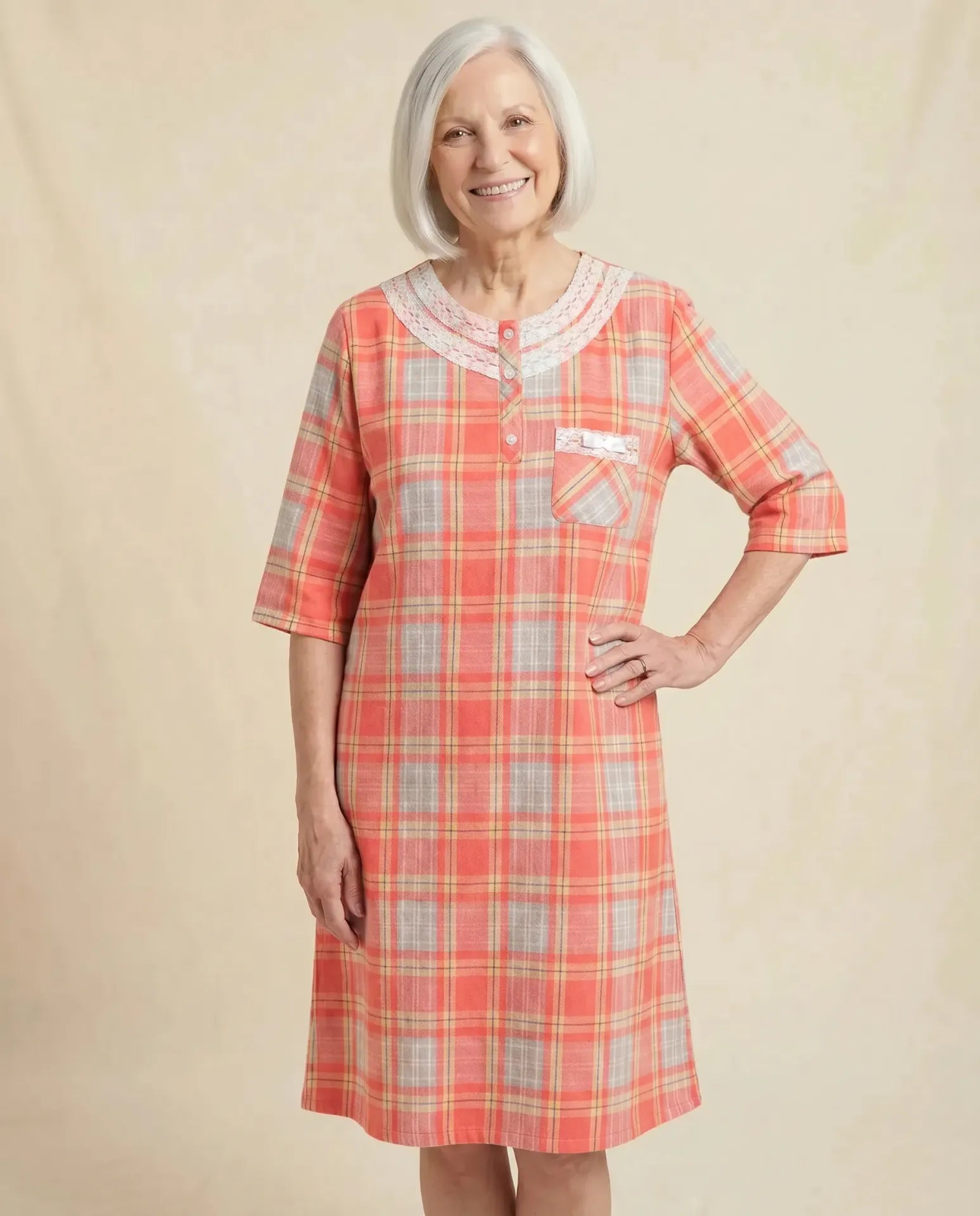 Mandy Nightgown - Coral, senior woman front view, parchment backdrop