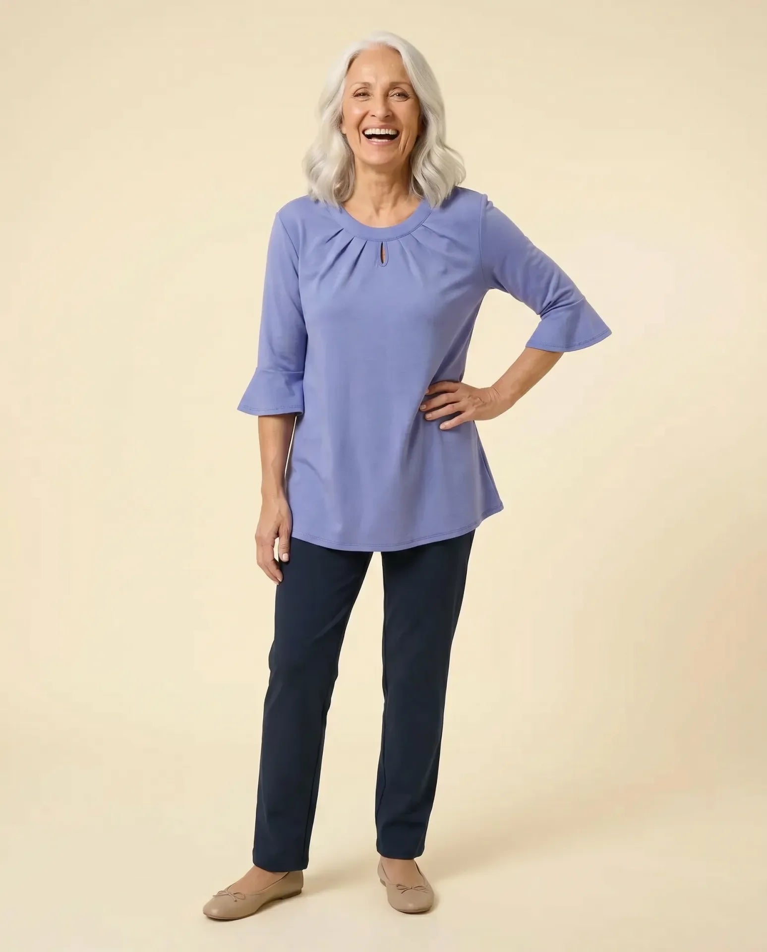 Senior woman wearing Ovidis adaptive lavender Cristy top with bell sleeves and keyhole neckline, easy assisted dressing