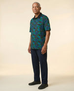 Senior man wearing Ovidis adaptive tropical print polo shirt