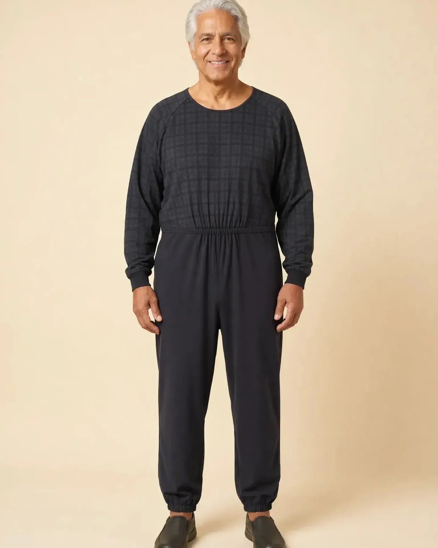 Senior man wearing Ovidis adaptive Henry Black Check jumpsuit, full body front view