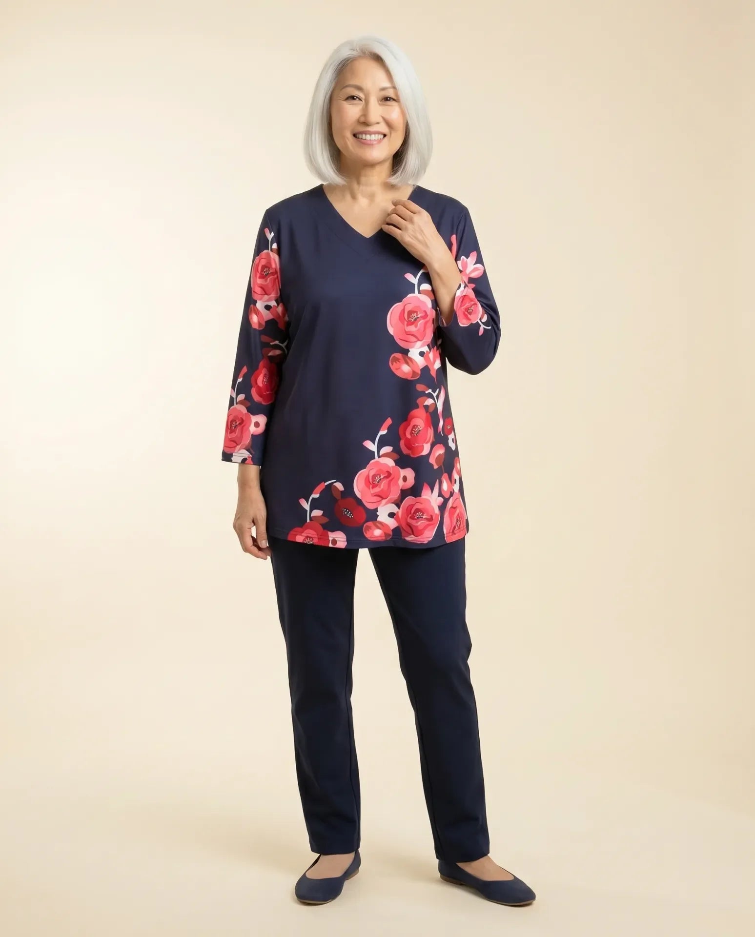 Senior woman wearing Ovidis adaptive navy rose floral top, easy assisted dressing