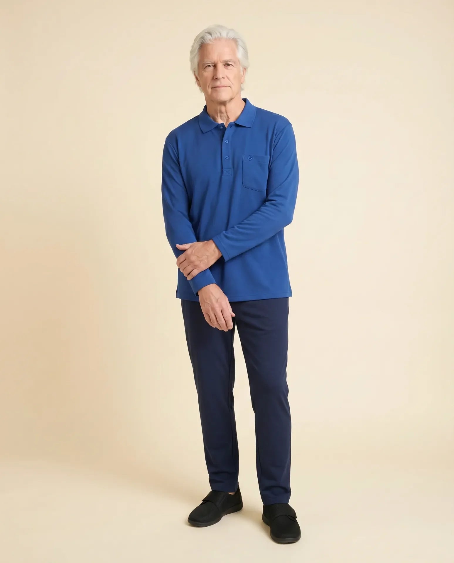 Senior man wearing Ovidis adaptive Thomas Blue cobalt polo shirt, easy assisted dressing for seniors