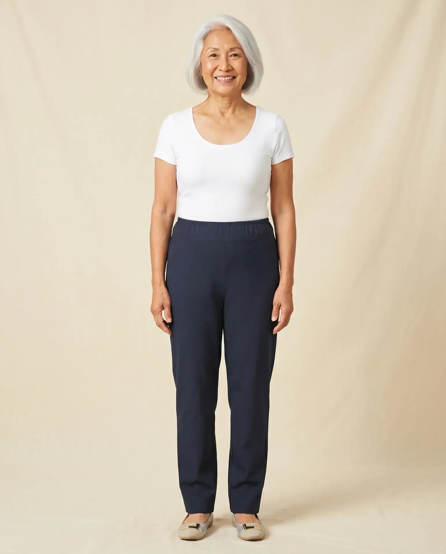 Senior Asian woman wearing Ovidis Sara Pants in Navy, full body front view