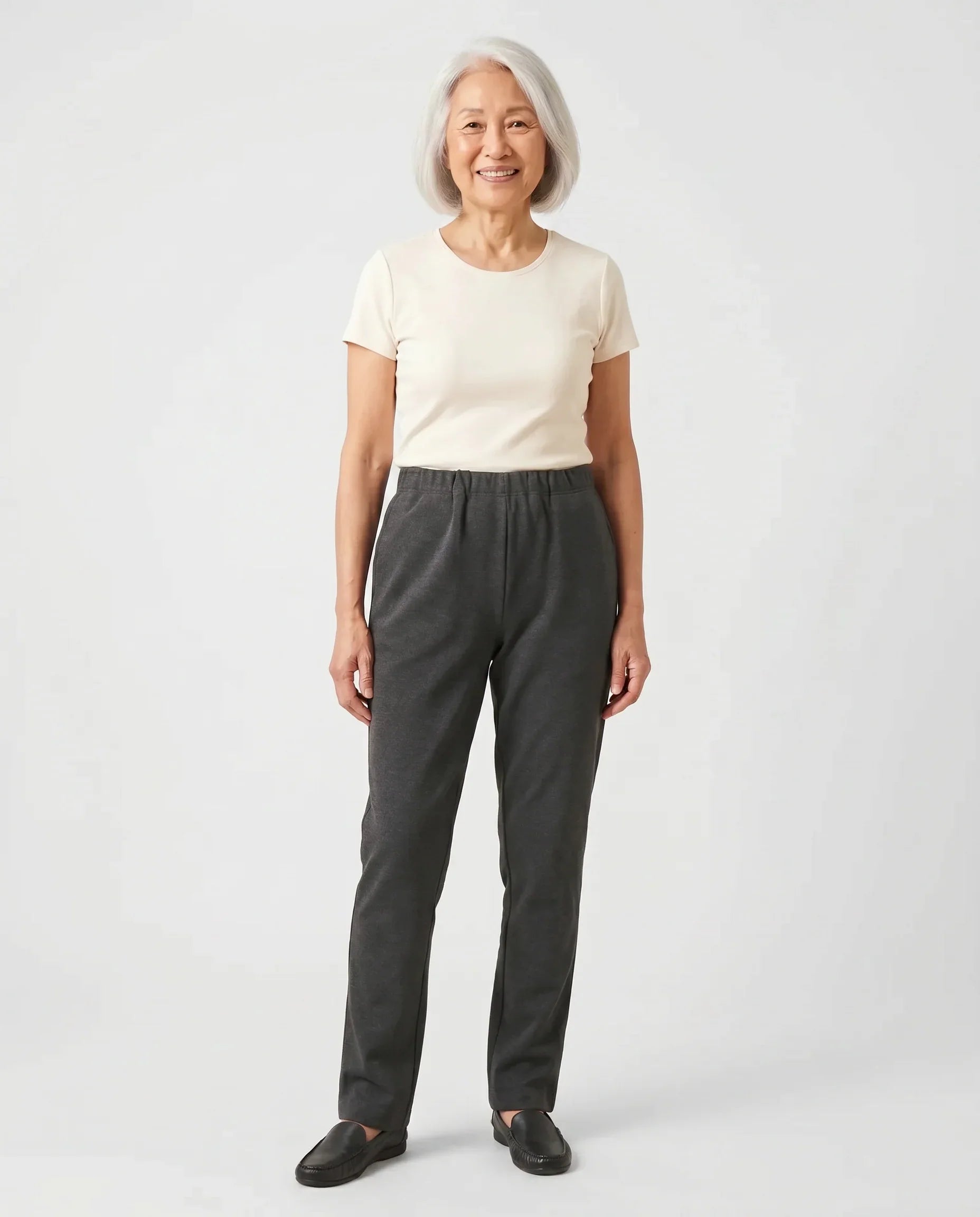 Senior Asian woman wearing Ovidis Arie Pants in Charcoal, full body front view