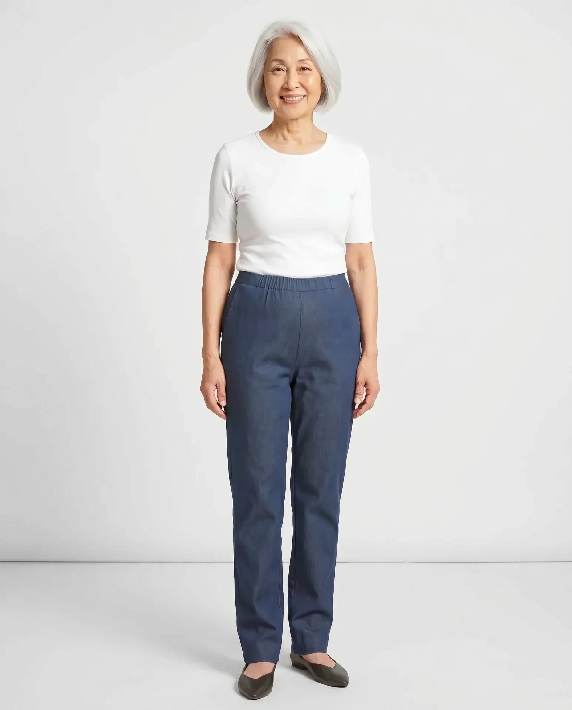 Senior Asian woman wearing Ovidis Arie Jeans in Denim, full body front view