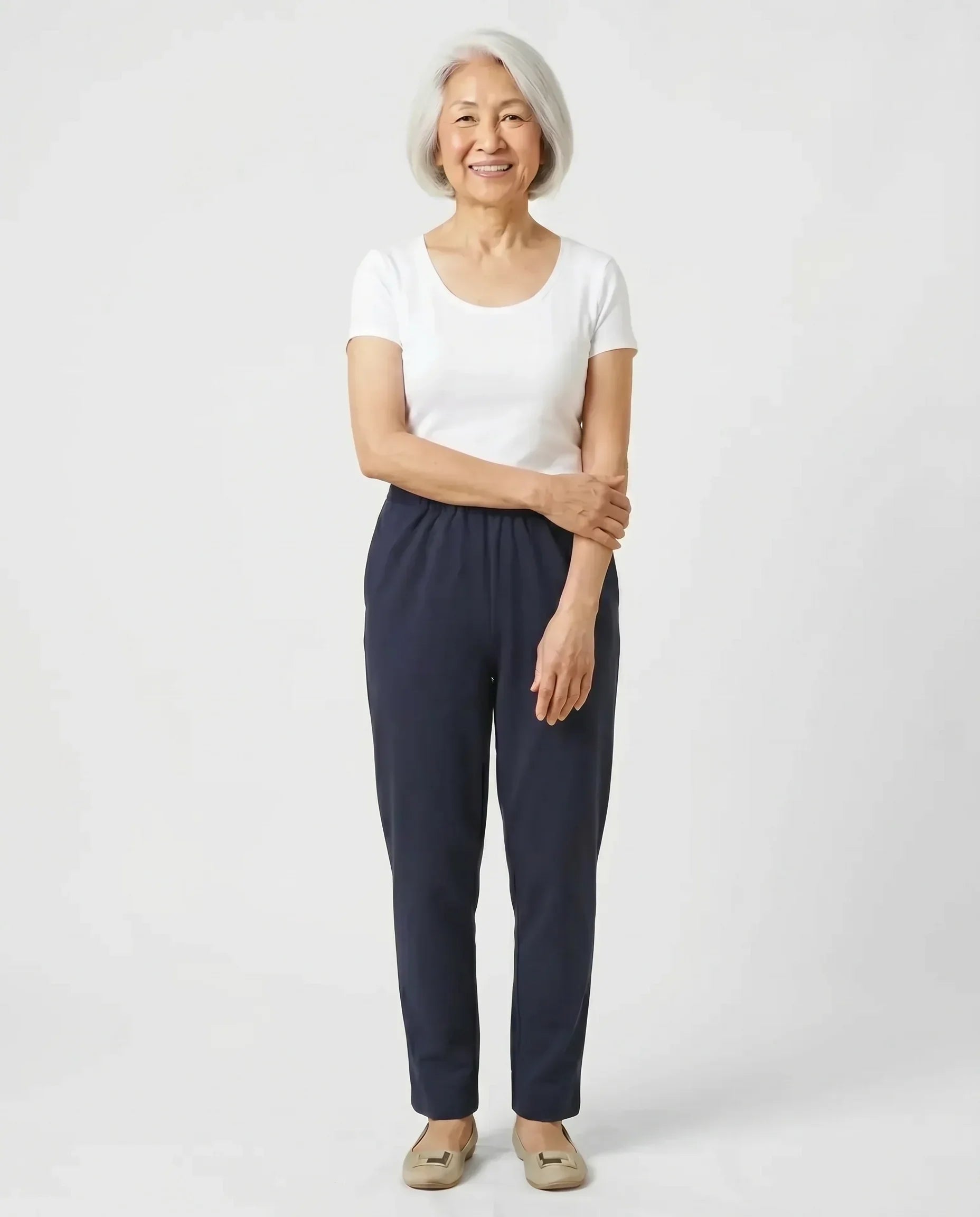 Senior Asian woman wearing Ovidis Arie Pants in Navy, full body front view