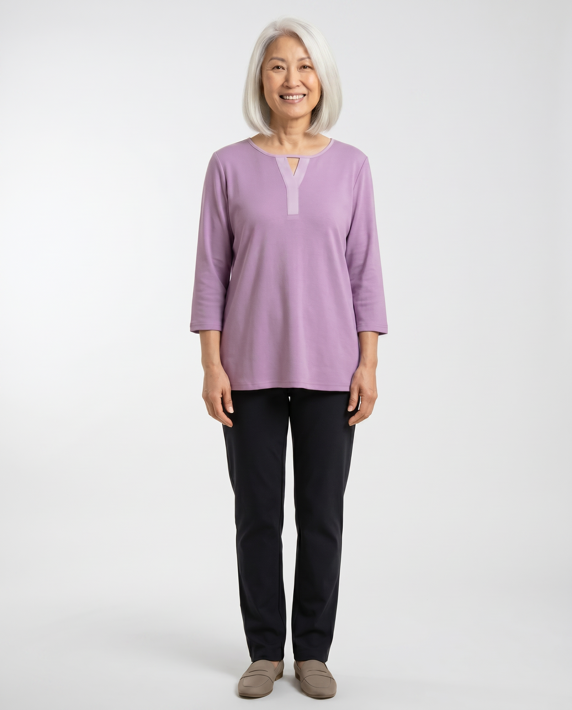 Senior woman wearing Ovidis adaptive mauve top with keyhole V-insert, easy dressing
