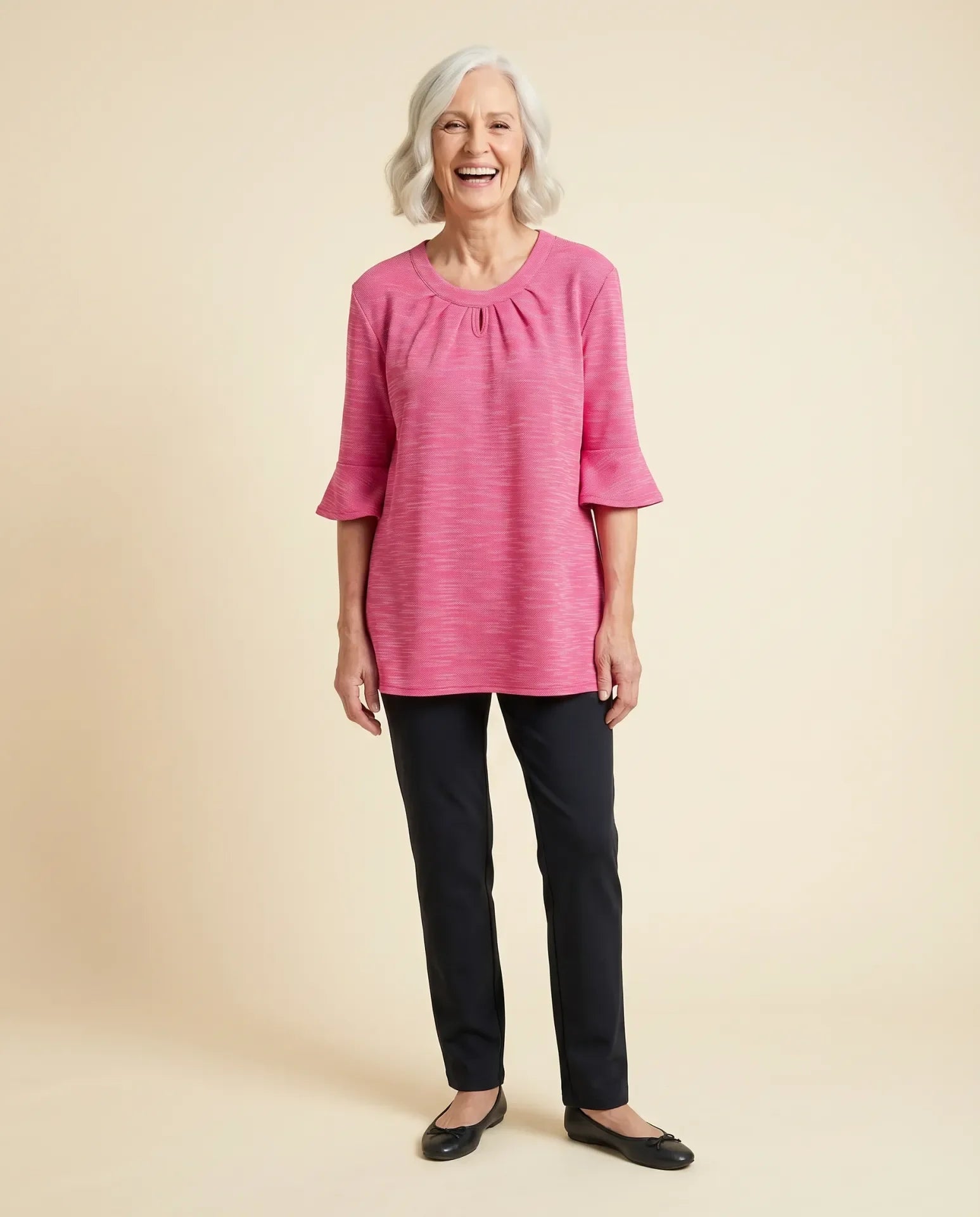 Senior woman wearing Ovidis adaptive orchid top with bell sleeves and keyhole neckline, easy dressing