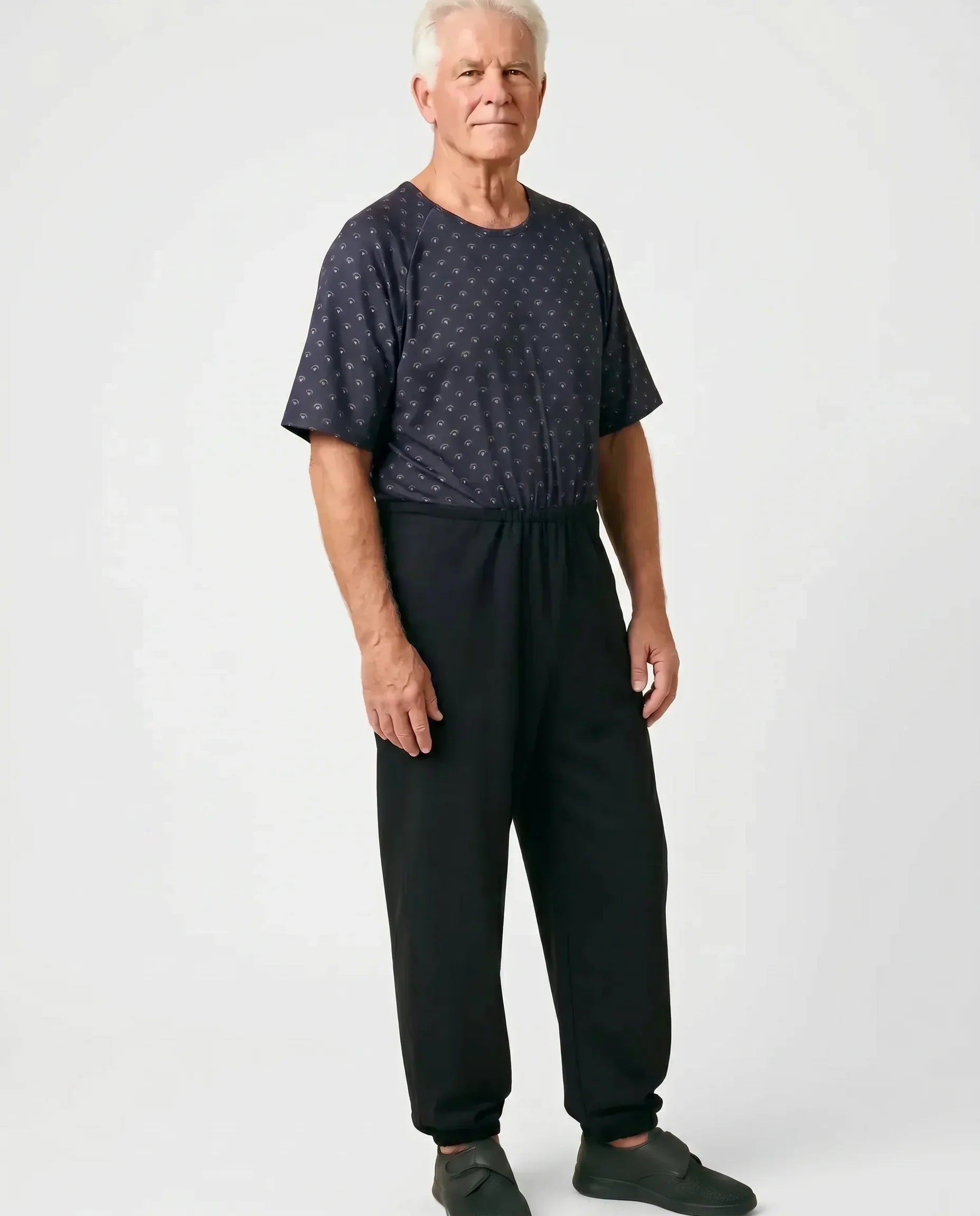 Senior man wearing Ovidis adaptive Bobby Copper jumpsuit, full body front view
