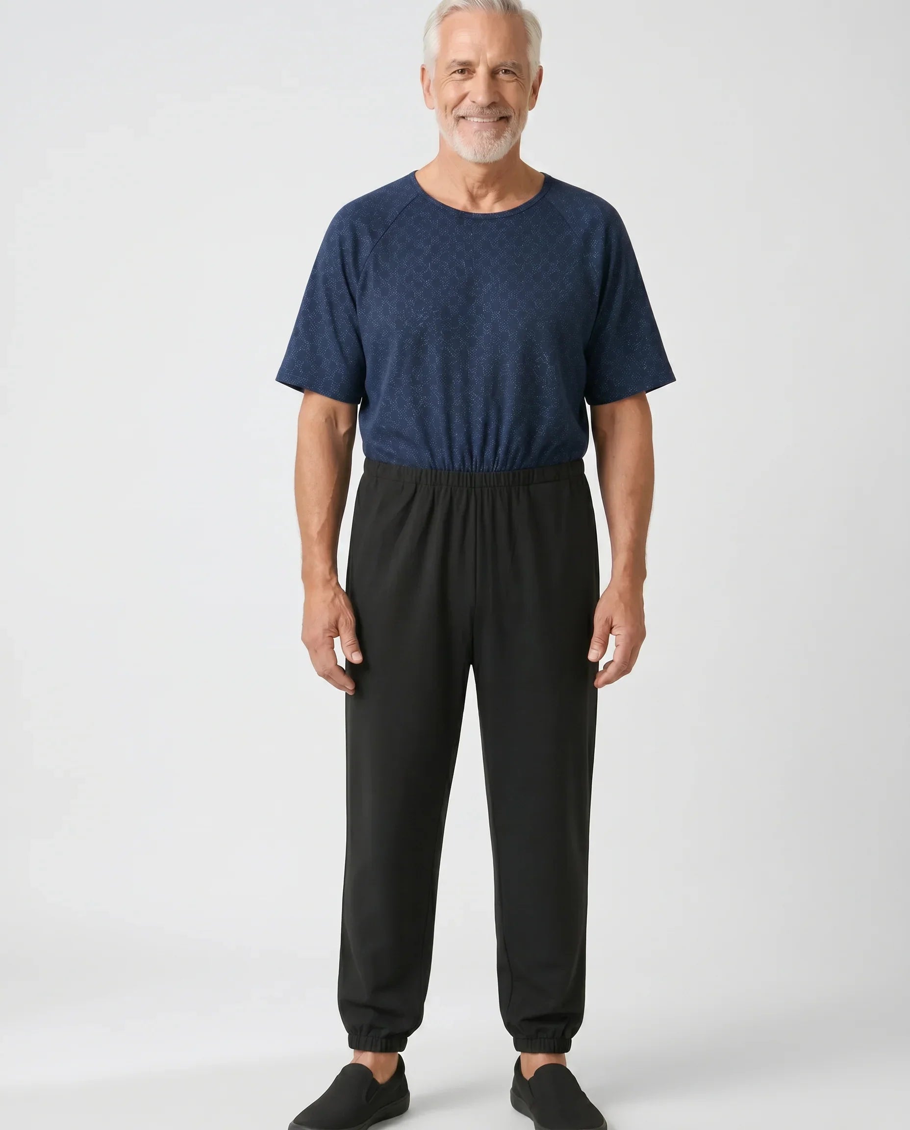 Senior man wearing Ovidis adaptive Bobby Starlight jumpsuit, full body front view