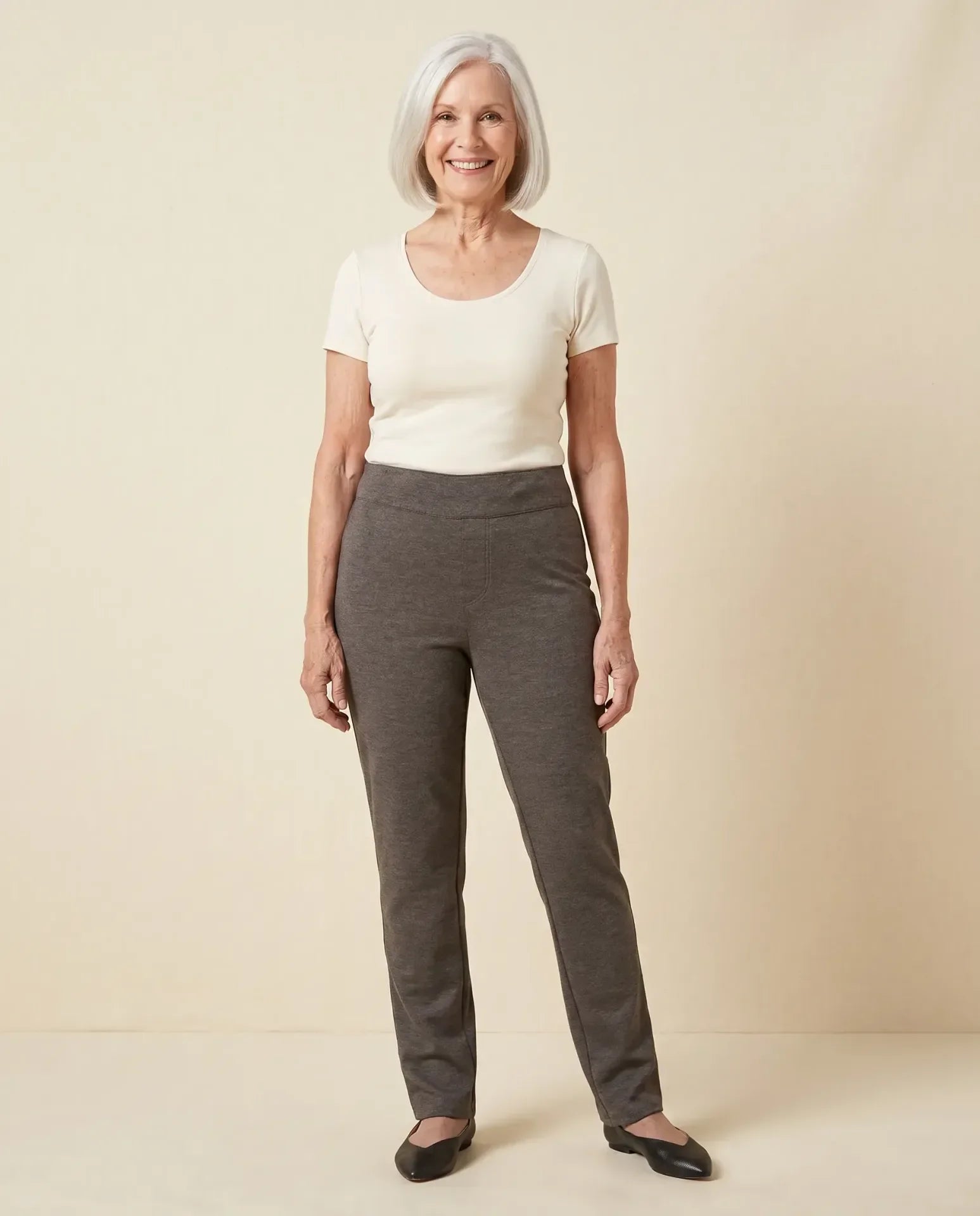 Senior woman wearing Ovidis Tricotti Pants in Charcoal, full body front view