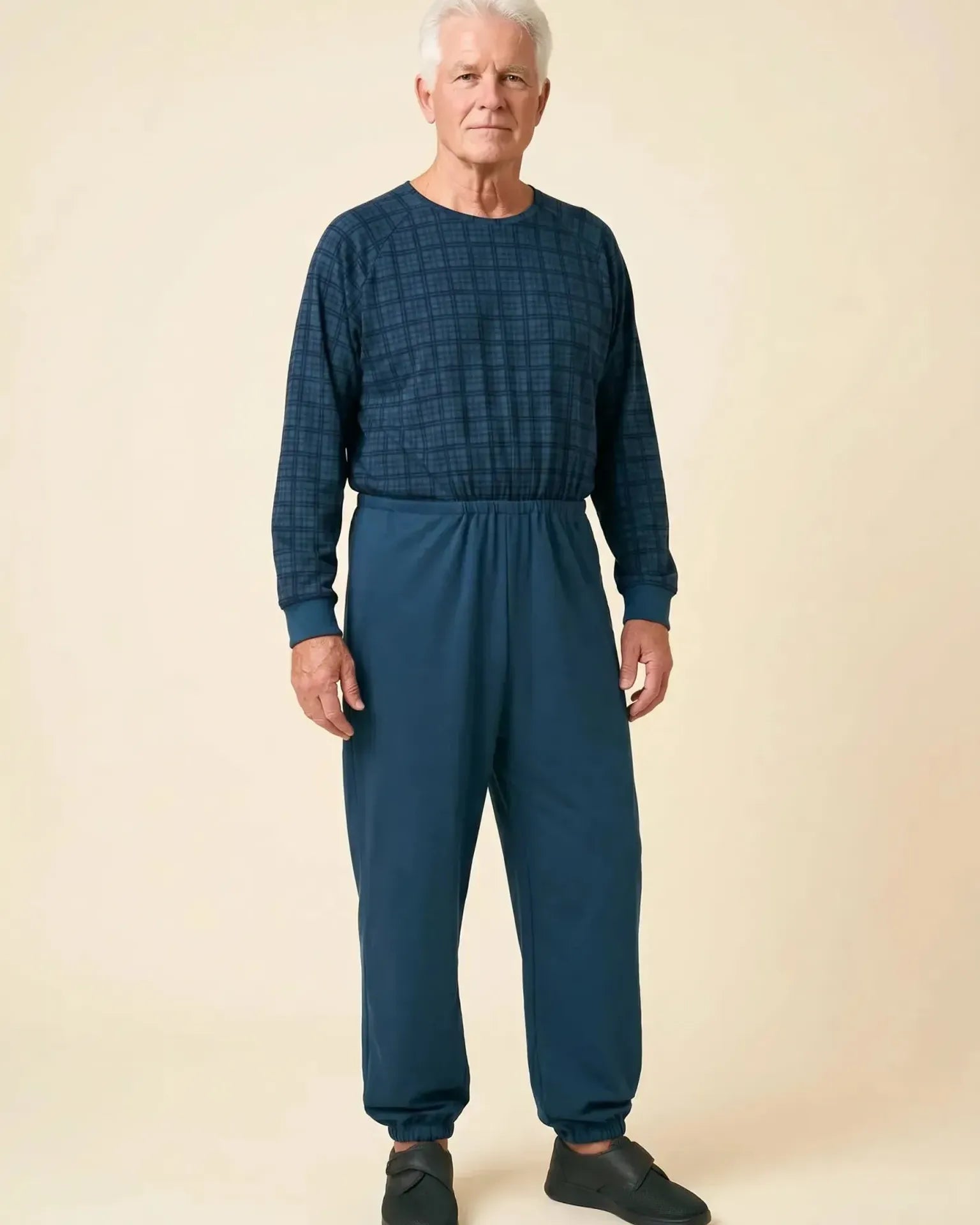 Senior man wearing Ovidis adaptive Henry Navy Check jumpsuit, full body front view