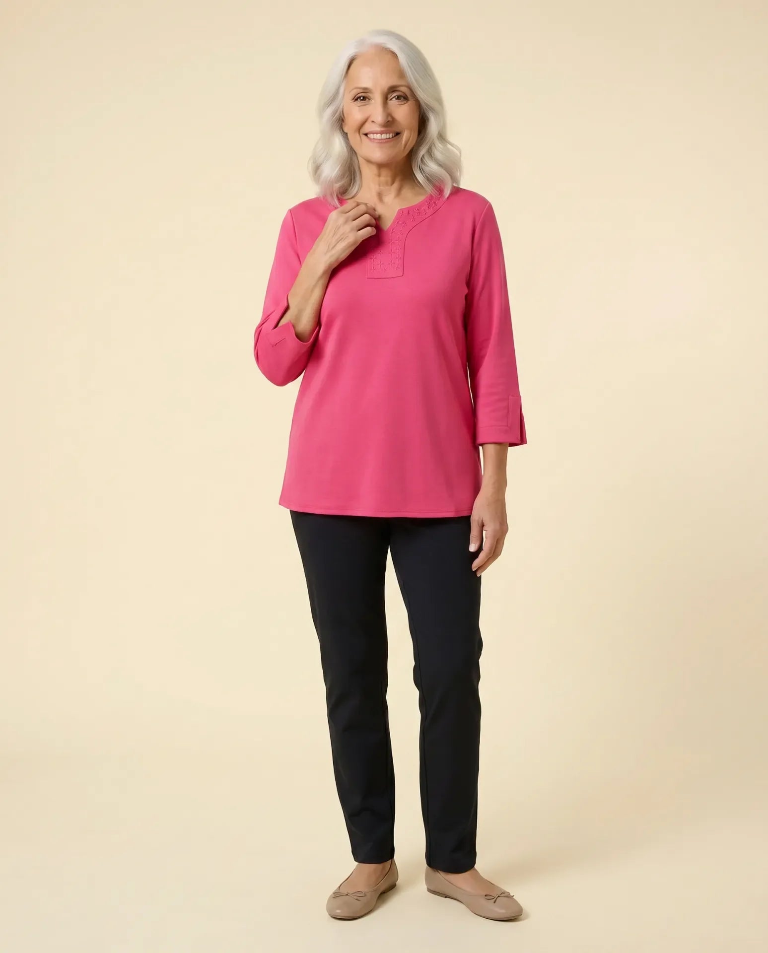 Senior woman wearing Ovidis adaptive pink top with embroidered neckline panel, easy dressing