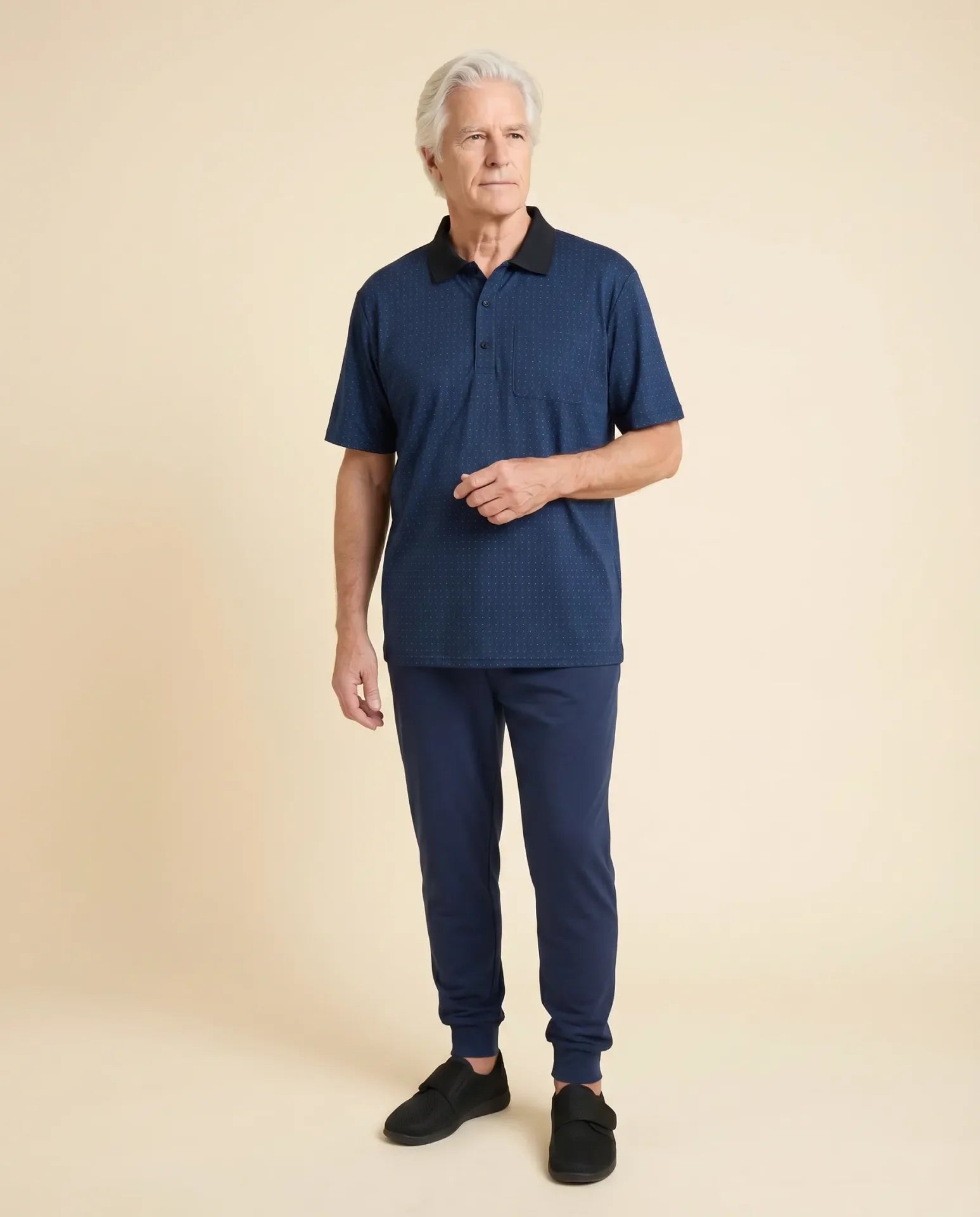 Senior man wearing Ovidis adaptive twilight pattern polo shirt