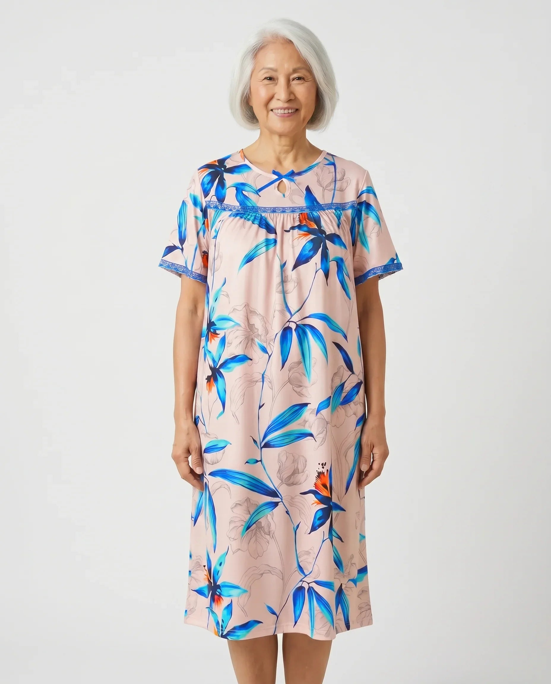 Senior woman wearing Hanna Nightgown in Pink tropical floral, front view