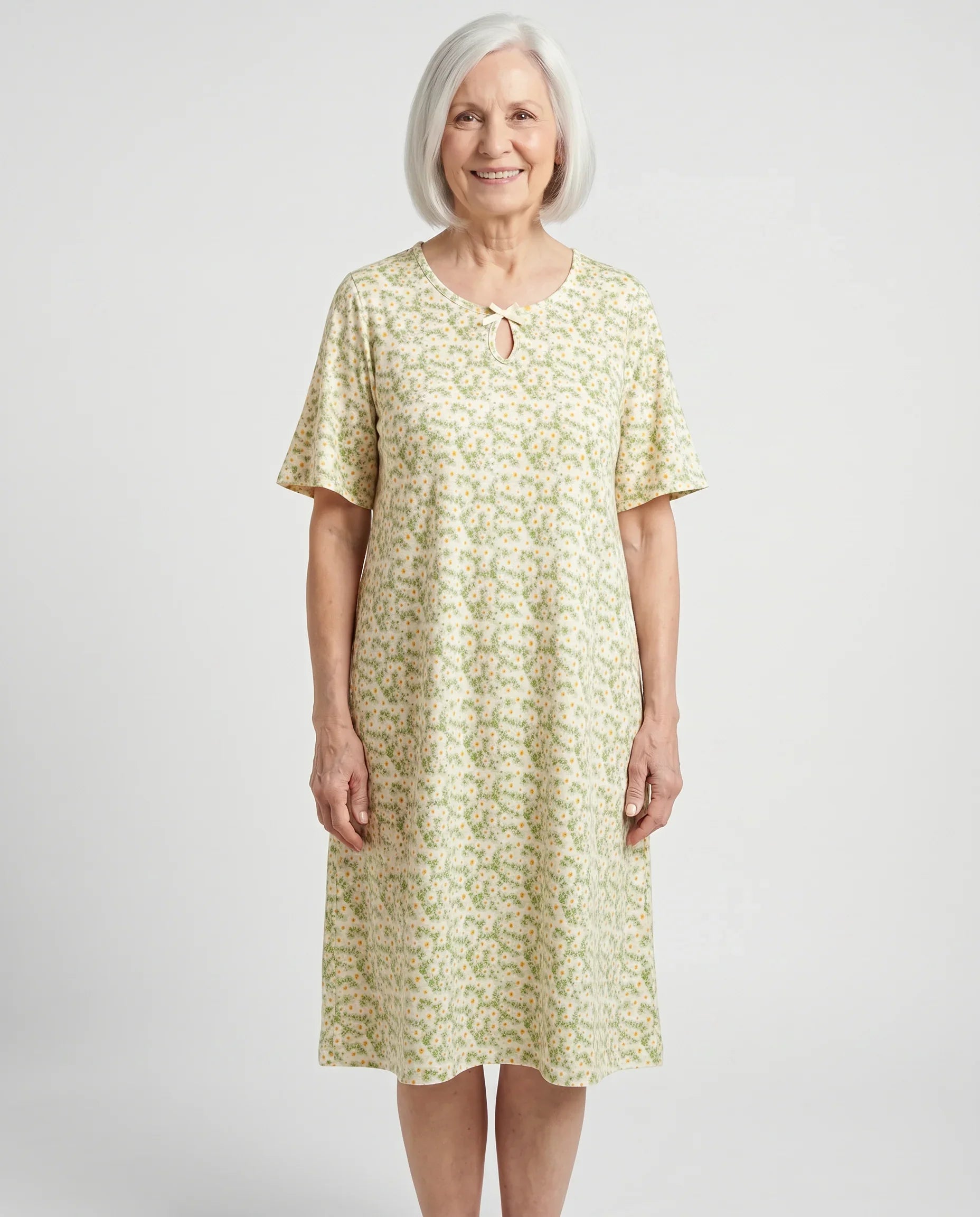 Senior woman wearing Iris Nightgown in Green floral, front view