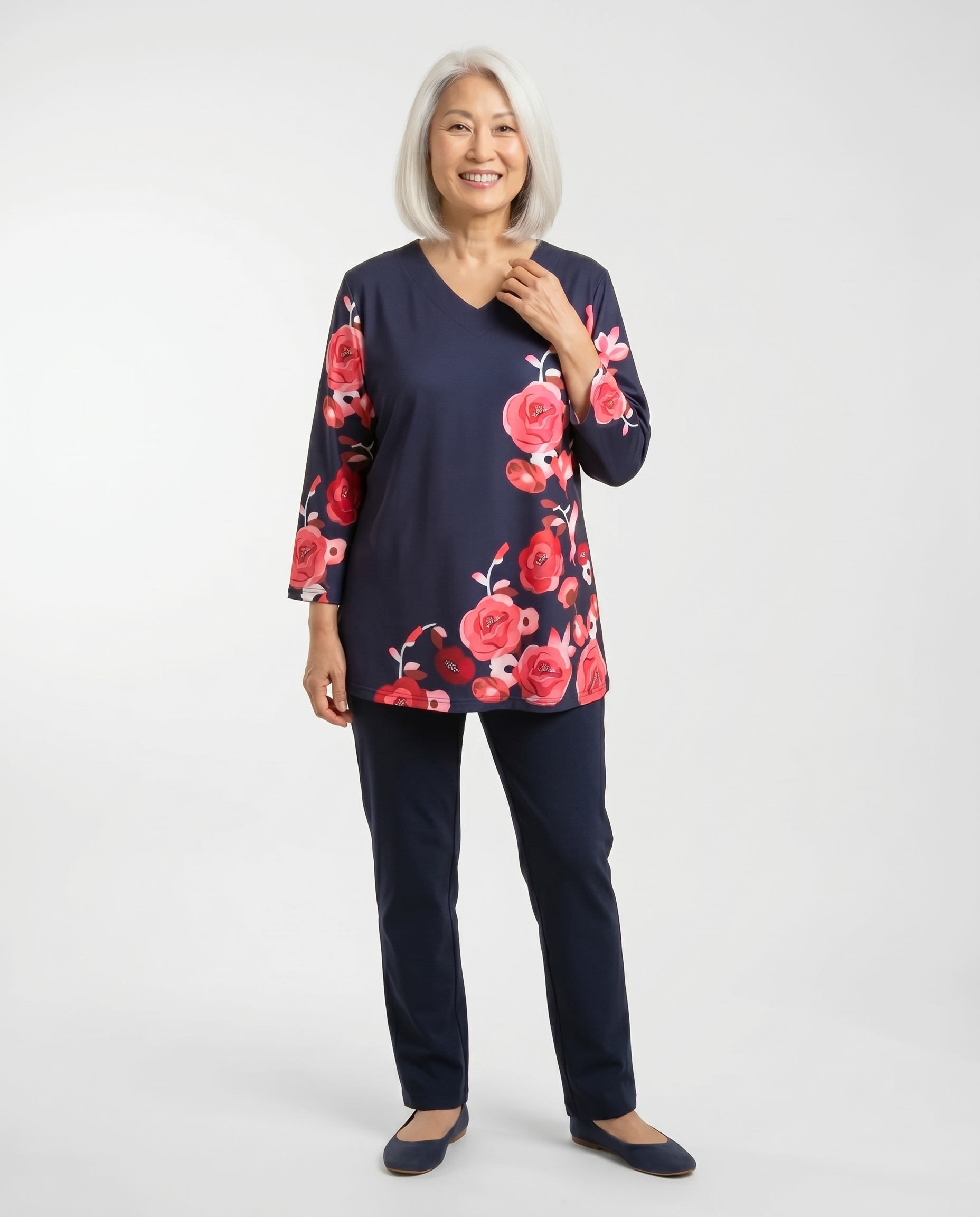 Senior woman wearing Ovidis adaptive navy rose floral top, easy assisted dressing