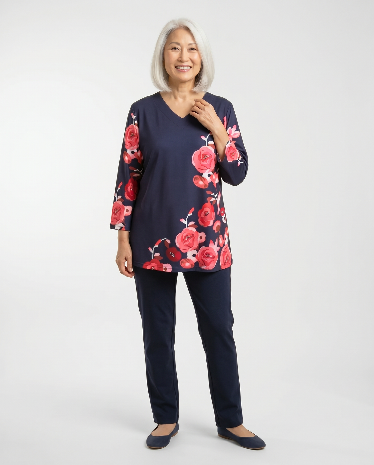 Senior woman wearing Ovidis adaptive navy rose floral top, easy assisted dressing