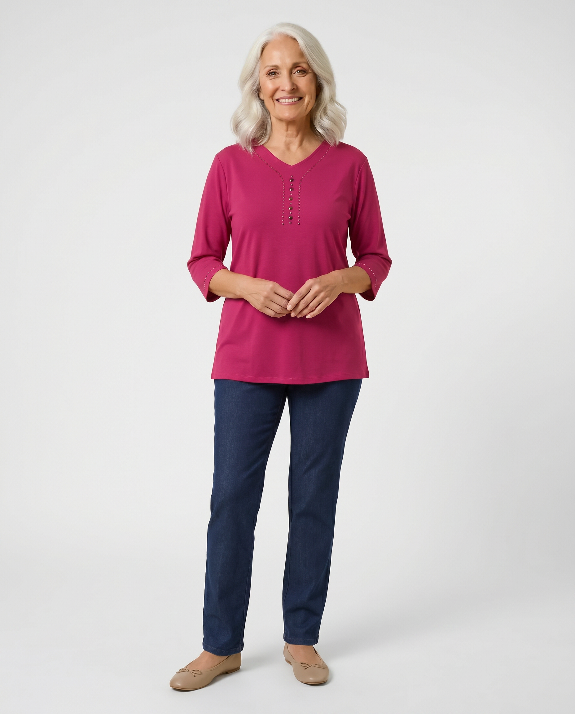 Senior woman wearing Ovidis adaptive raspberry top with stud button detail, easy dressing