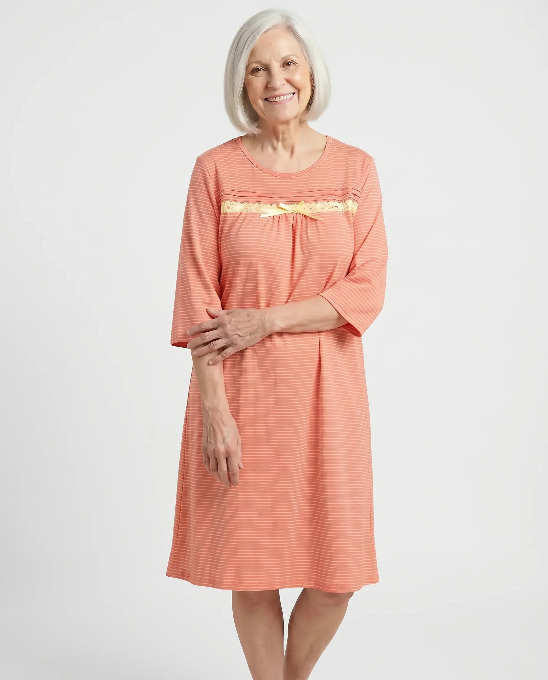 Senior woman wearing Olivia Nightgown in Peach, front view