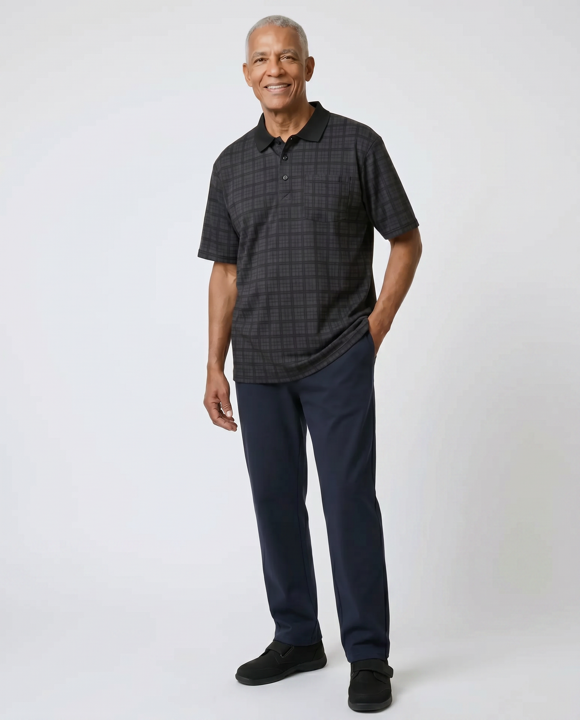 Senior man wearing Ovidis adaptive black check polo shirt