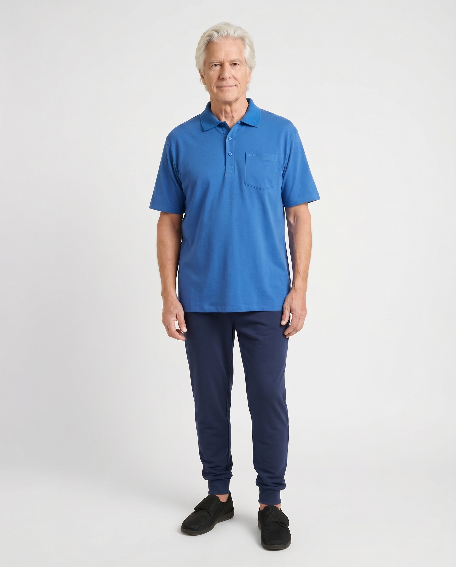 Senior man wearing Ovidis adaptive Ralfie Blue polo shirt, easy assisted dressing for seniors