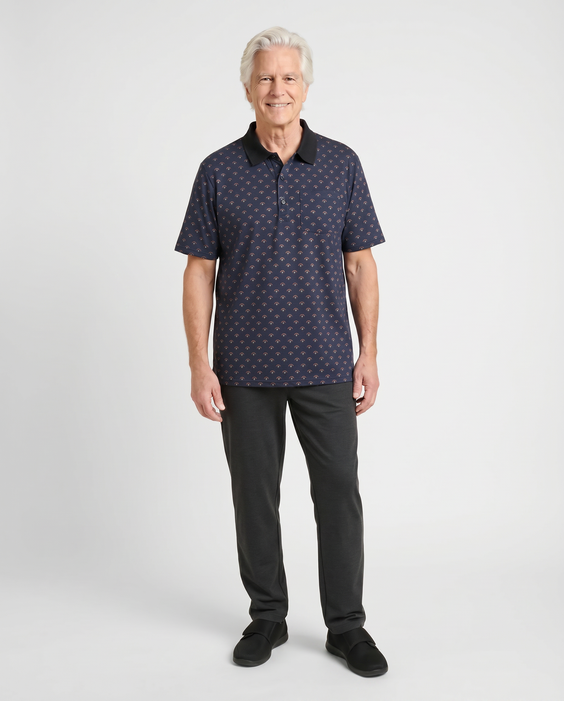 Senior man wearing Ovidis adaptive copper pattern polo shirt