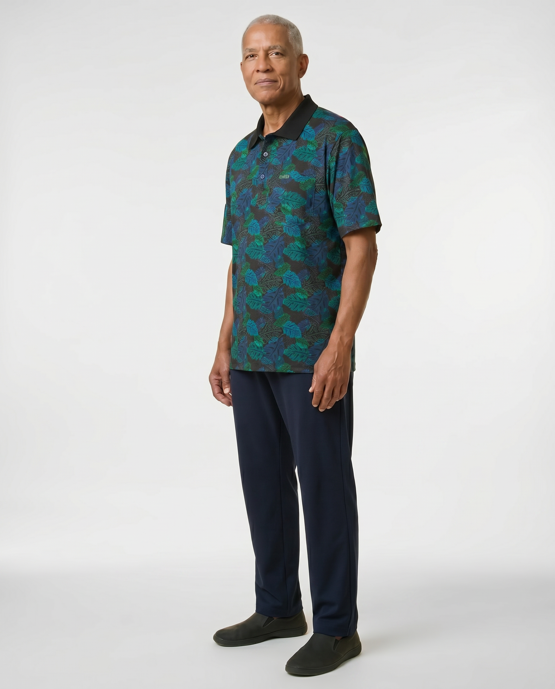Senior man wearing Ovidis adaptive tropical print polo shirt