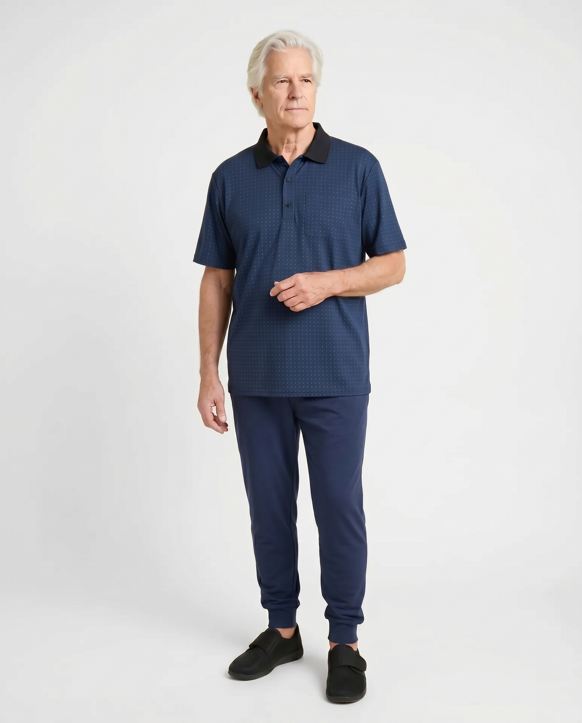 Senior man wearing Ovidis adaptive twilight pattern polo shirt