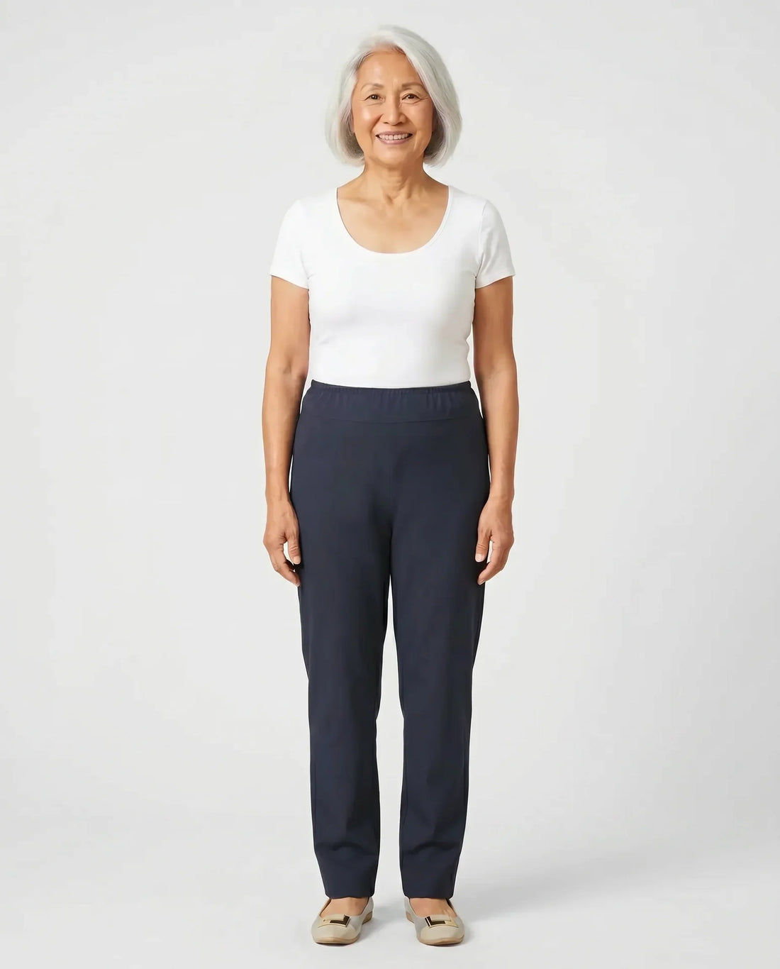 Senior Asian woman wearing Ovidis Sara Pants in Navy, full body front view