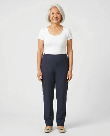 Senior Asian woman wearing Ovidis Sara Pants in Navy, full body front view