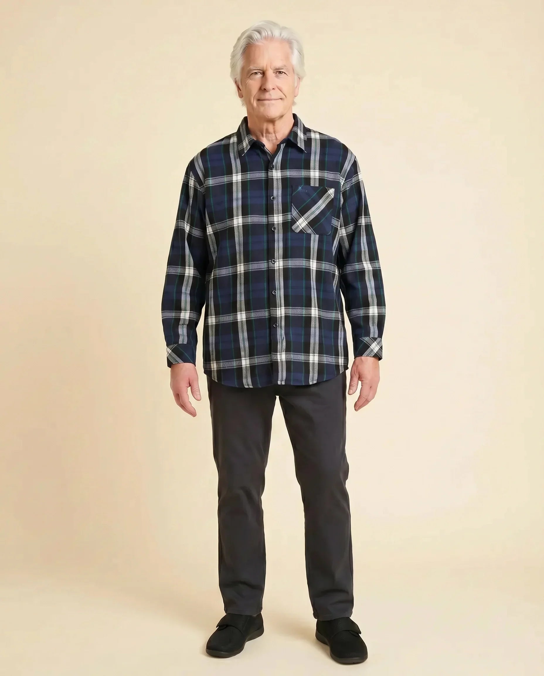 Senior man wearing Ovidis adaptive Theo Midnight plaid flannel shirt, loose relaxed fit, easy assisted dressing for seniors