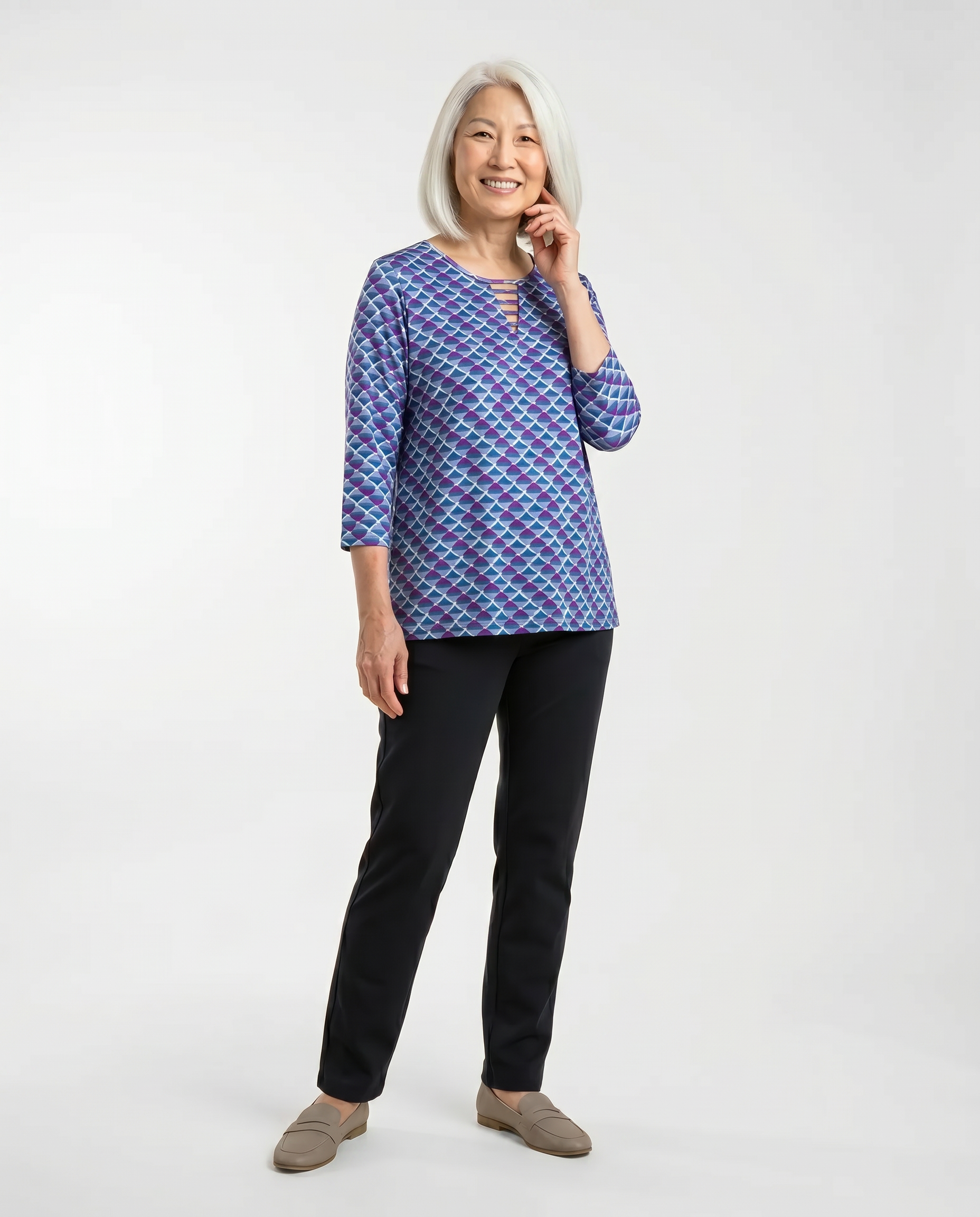 Senior woman wearing Ovidis adaptive cobalt geometric top with ladder neckline detail, easy dressing