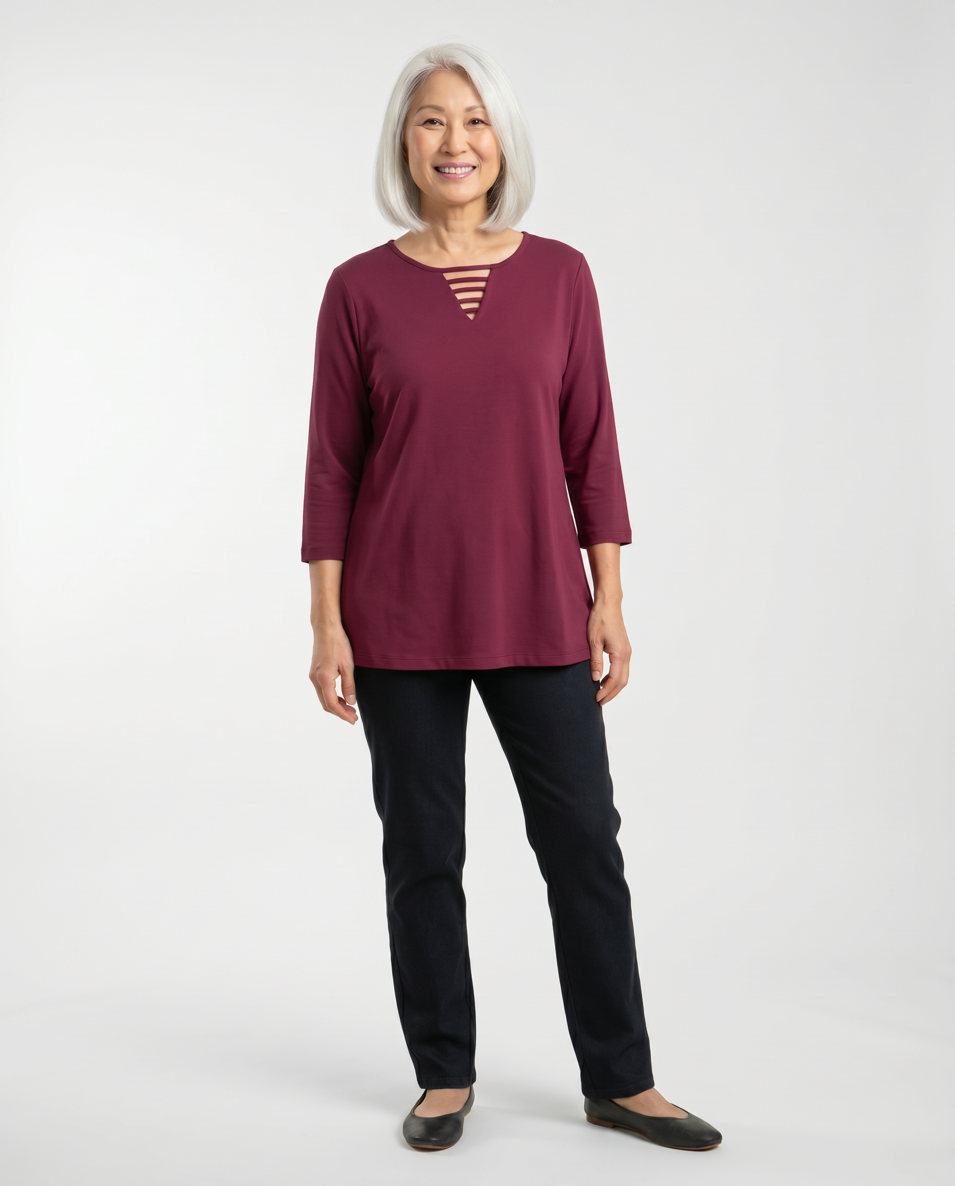 Senior woman wearing Ovidis adaptive dark wine fuchsia top with ladder neckline detail, easy dressing