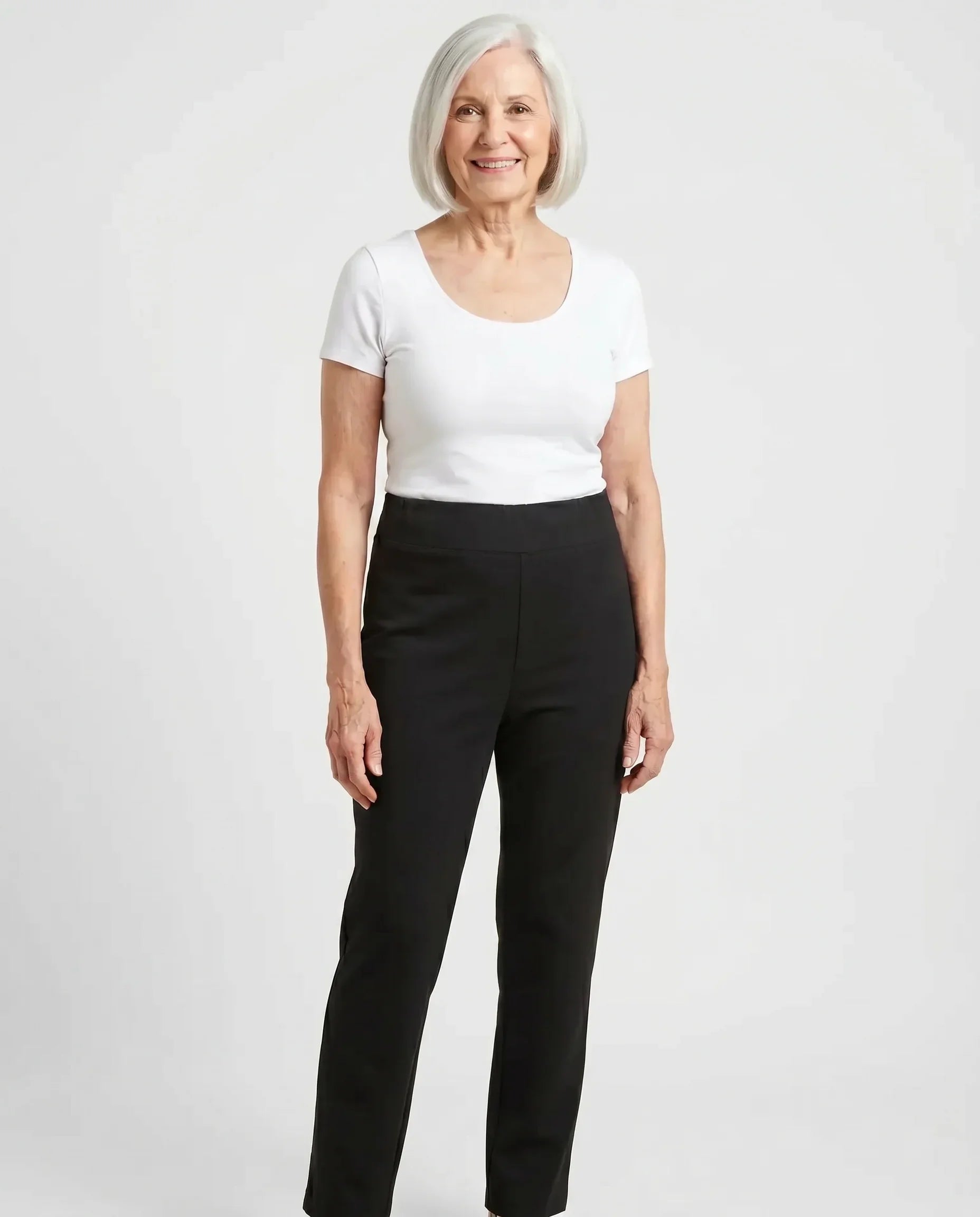 Senior woman wearing Ovidis Tricotti Pants in Black, full body front view