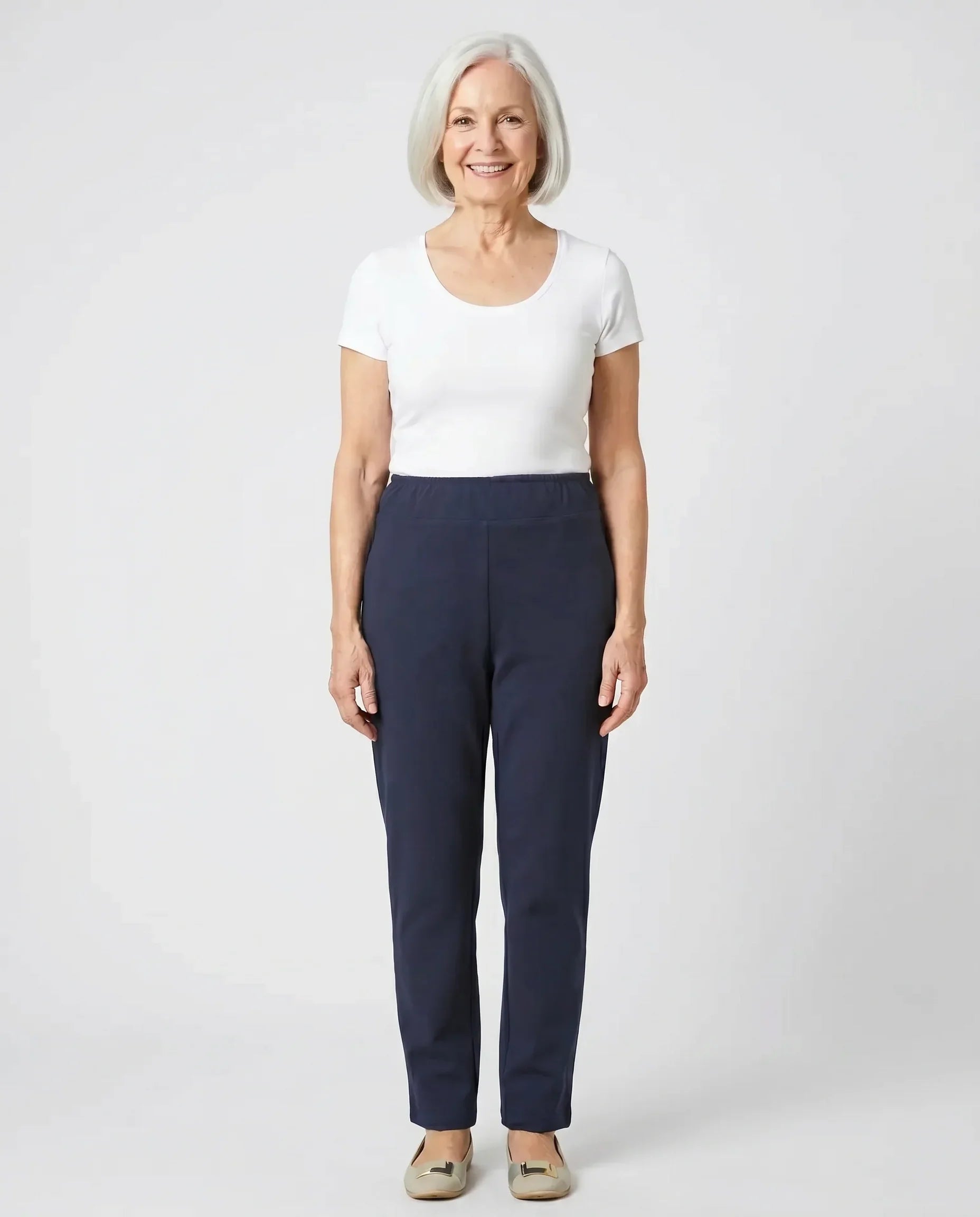 Senior woman wearing Ovidis Tricotti Pants in Navy, full body front view