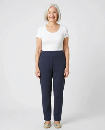 Senior woman wearing Ovidis Tricotti Pants in Navy, full body front view