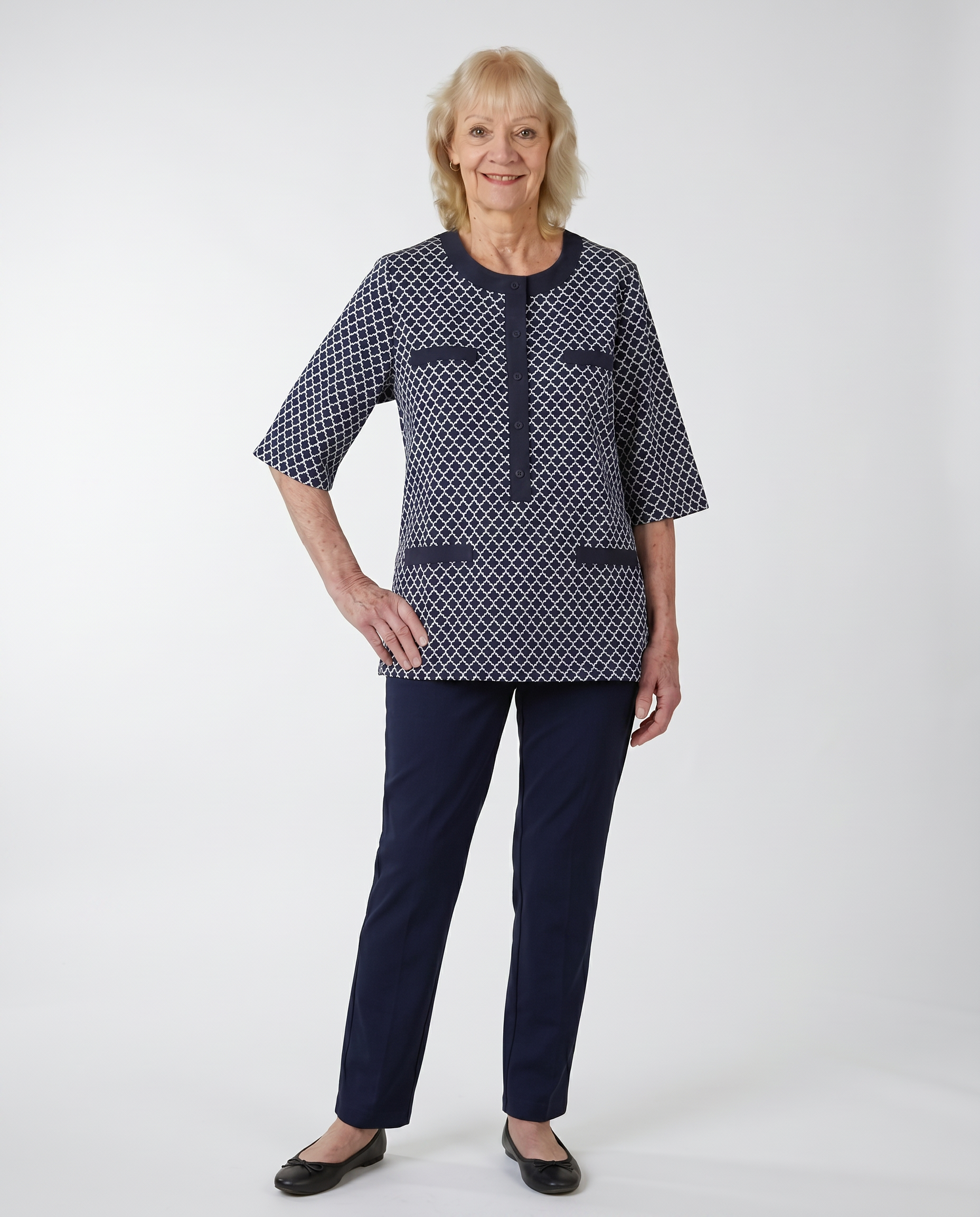 Senior woman wearing adaptive navy jacquard tunic top with elbow-length sleeves and decorative pocket welts